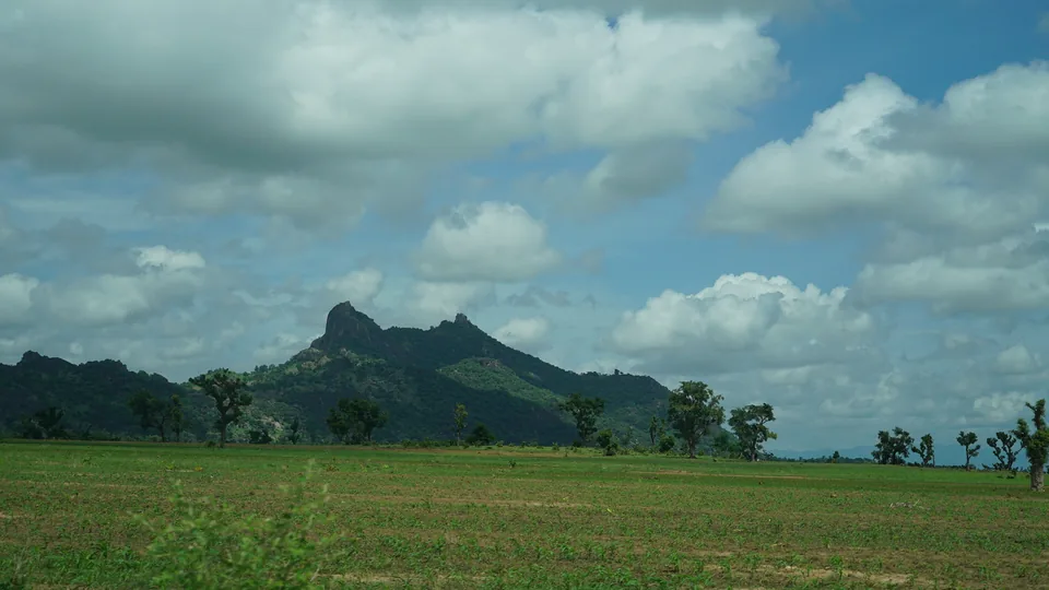 Farmland below a mountain range, Adamawa State